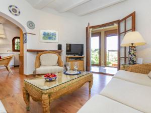 a living room with a couch and a table at Villa Venecia by Interhome in Calonge