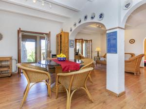 a dining room with a table and chairs at Villa Venecia by Interhome in Calonge
