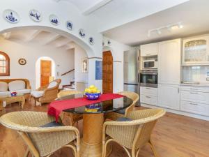 a kitchen and living room with a table and chairs at Villa Venecia by Interhome in Calonge