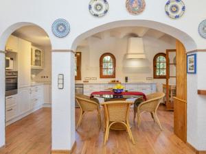 a large kitchen with a table and chairs at Villa Venecia by Interhome in Calonge +29 photos