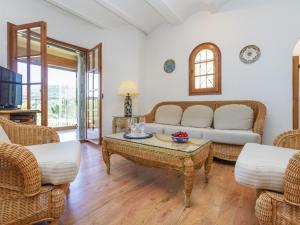 a living room with a couch and a table at Villa Venecia by Interhome in Calonge