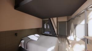 a bedroom with a large white bed and a window at Centrum Hotel in Akureyri
