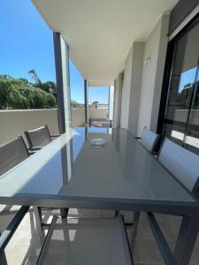 a glass table in a room with chairs at La Romantica in Riccione +10 photos