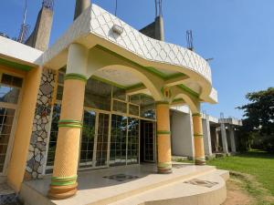 a building with an archway on the side of it at Oundo LVHAR in Busia