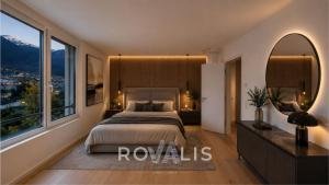 a bedroom with a large bed and a large window at Private Panorama Spa Brig in Brig