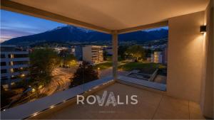 a balcony with a view of a city at Private Panorama Spa Brig in Brig