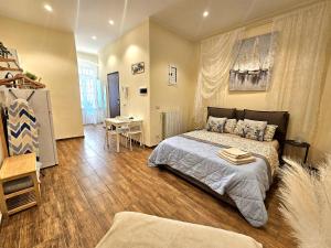 a bedroom with a bed and a table in it at BARI SOUL old town in Bari