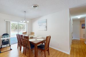 a dining room with a table and chairs at Serenity House - 1006 Ave 26th in Vero Beach