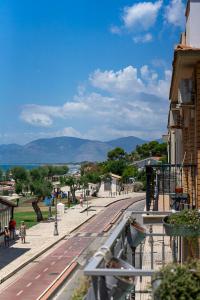 a train station with people walking on a street at Casa Canzatora in Sperlonga