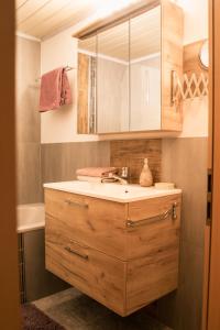 a bathroom with a sink and a mirror at Landhaus am Hügel in Bad Gastein +47 photos