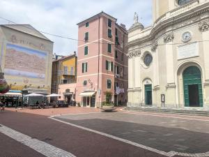 a city street with buildings and a clock tower at Apartment casa JS by Interhome in Imperia