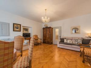 a living room with a couch and chairs at Apartment Catherine by Interhome in Pellizzano