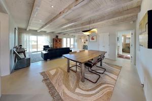 a living room with a table and a couch at Five Ravens in Santa Fe