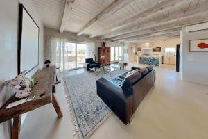 a large living room with a couch and a table at Five Ravens in Santa Fe