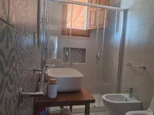 a bathroom with a sink and a toilet and a shower at Marina Serra in Marina Serra +24 photos