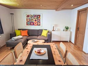 a living room with a couch and a table at Apartment 3 Bettwohnung by Interhome in Sils Maria