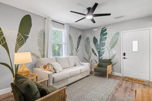 a living room with a couch and a ceiling fan at The Cedar Loft B - Team Joseph Ellen in St. Augustine +9 photos