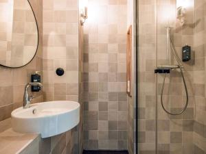 a bathroom with a sink and a shower at ibis Styles La Rochelle Centre Gare in La Rochelle +125 photos