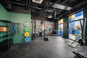 a room with a gym with a wall covered in graffiti at Hife Bordeaux in Bordeaux