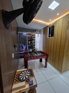 a room with a table and a chess board at Hotel e Pousada REQUINTTE in Parnaíba +18 photos