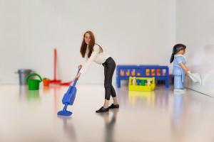 a woman is playing with a toy with a spade at Stay 19 - 2 bedroom hotelapartment with free parking in Groningen