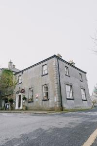an old brick building on the side of a street at Corrib House Guest Accommodation in Galway