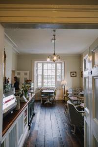 a dining room with a table and a window at Corrib House Guest Accommodation in Galway
