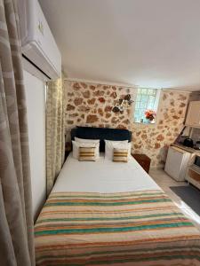 a bedroom with a large bed in a room at Rodon Apartments in Tsoukalades +25 photos