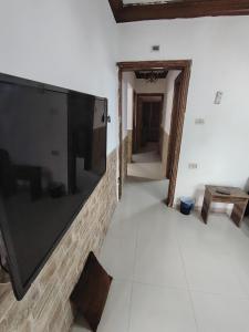 a room with a large flat screen tv on the wall at شقة سرايا in Irbid