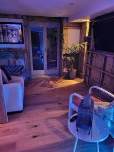 a living room with a couch and a table at The Seaside Hideaway St Leonards in Hastings