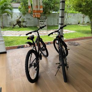 two bikes are parked next to a pole at Villa Tropical Oasis in Balapitiya