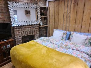 a bedroom with a bed and a mirror at The Seaside Hideaway St Leonards in Hastings