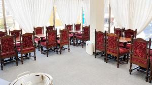 a dining room with a long table and chairs at Hotel Higashihiroshima Hills Saijo in Higashihiroshima