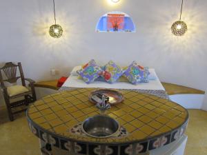 a bathroom with a sink in the middle of a room at Amaranto Bed and Breakfast in Cozumel