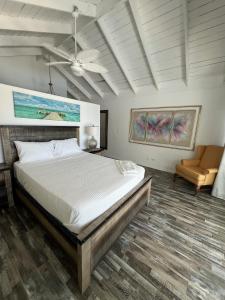 a bedroom with a large bed and a couch at El Tridente in Juan Dolio +43 photos