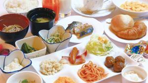 a table with plates of food and bowls of food at Hotel Higashihiroshima Hills Saijo in Higashihiroshima +23 photos