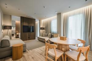 a living room with a couch and a table at Evangelisti Palace in Bellaria-Igea Marina