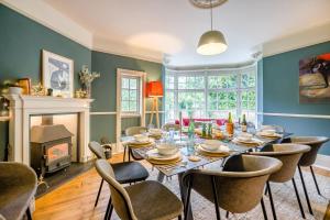 a dining room with a table and chairs and a fireplace at 5 Bed in Church Stretton oc-t30413 in Church Stretton