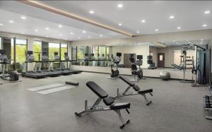 a gym with several exercise bikes and treadmills at Courtyard by Marriott Birmingham Grandview in Birmingham
