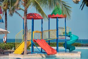 a pool with a slide at a resort at Sunrise Pool Villa Cam Ranh in Cam Ranh