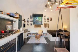 a kitchen with a table and an umbrella at Villa Cangiani in Massa Lubrense