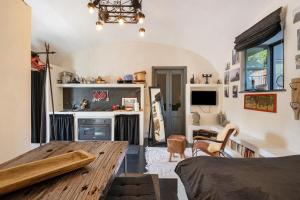 a kitchen with a wooden table in a room at Villa Cangiani in Massa Lubrense