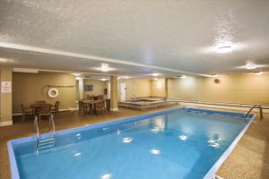 a large swimming pool in a hotel room at Longbranch 214 in Breckenridge