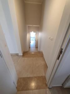 an empty hallway in a house with a door at Almaza bay Beach Town Chalet in Marsa Matruh