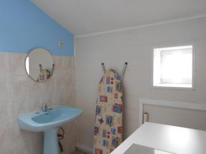a bathroom with a sink and a mirror at gite a la ferme in Milhac