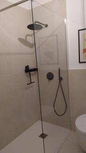 a shower in a bathroom with a toilet at Al vecchio Incasato in Grottammare