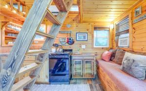 a kitchen with a couch in a tiny house at Shiners Shack in Newport