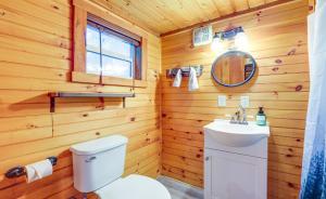a bathroom with a white toilet and a sink at Shiners Shack in Newport