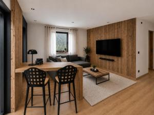 a living room with a table and two chairs at Eben Central Living in Eben im Pongau