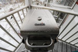 a grill sitting on the side of a balcony at Tannhauser 313 in Breckenridge